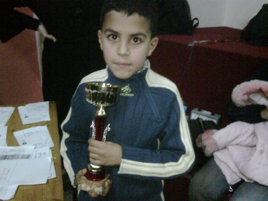 Me with my first (and only) chess Trophy (1st position).